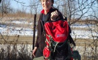 Wearing the Icebreaker Realfleece Sierra Hood over their Technical Base 200, shouldering the Wilderness Athlete Backpack