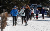 Snowshoe Clinic Ceal Walker (left) and Laurie Lambert (right) lead a warm-up lap at a snowshoe racing clinic in Red River, NM. Photo by Ellen Miller-Goins.