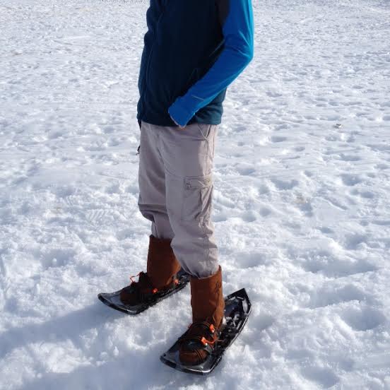 Trying out Manitobah mukluks while snowshoeing.  (Photo by Frank Meek.)