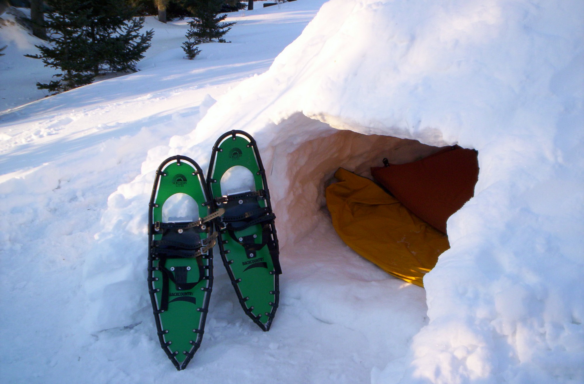 snowshoes outside of a quinzhee