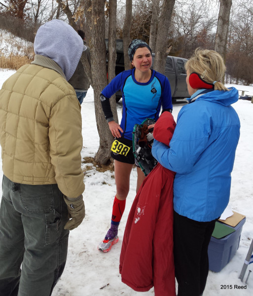 Bronze medalist in the Half, Robyn Reed asks Mike and Colleen Milloning why they're bundled up so . . . .