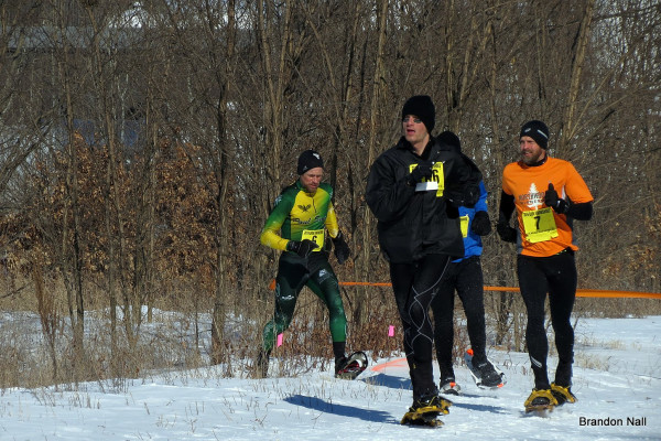 Fierce racing action clearing the woods for a "U-shaped" dash to the line. Robert Bolton (6) gets by the group and Jordan Neeck (not pictured, 15th) for 14th, while Jason Bond (7) edges ahead of Kris Borchardt (106) for 16th by three seconds. Hidden, Ryan Albu finished 17th for the age-class silver while Borchardt took its gold.