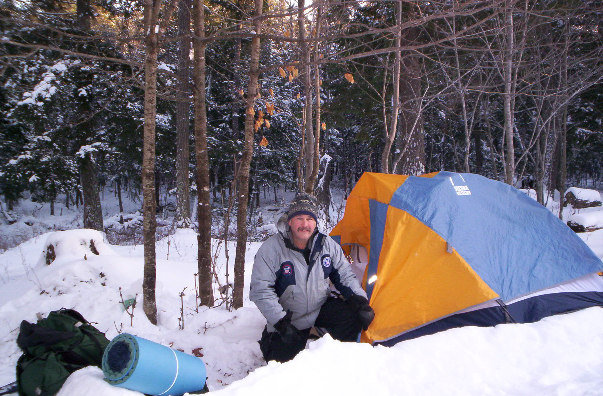 Jim Joque with a tent in the wilderness