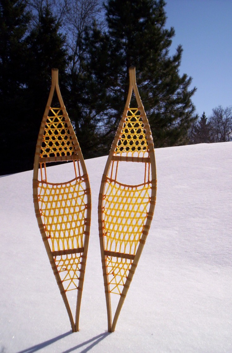 Ojibwa snowshoes sticking up in the snow