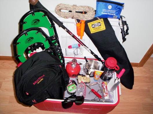 what to bring snowshoeing: close up of items laid on cooler