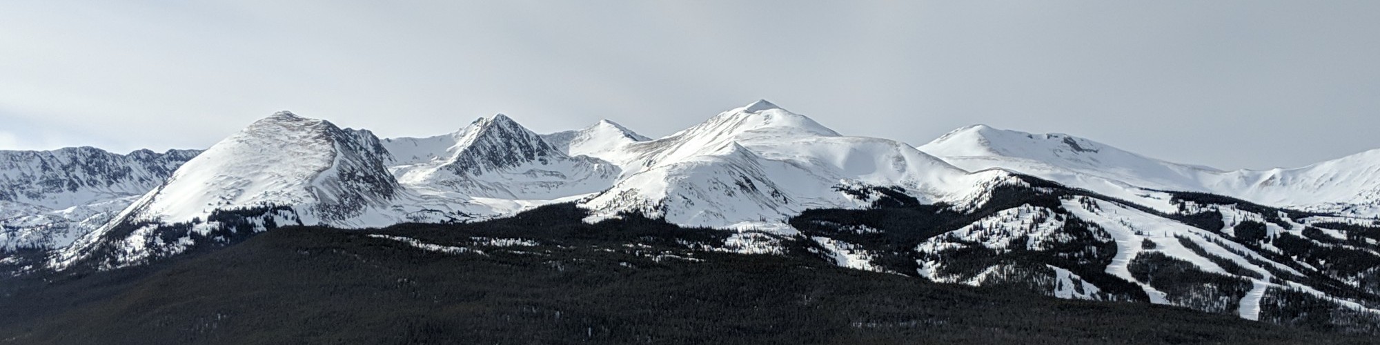 bright, cloudy sky with mountain in background, Breckenridge CO