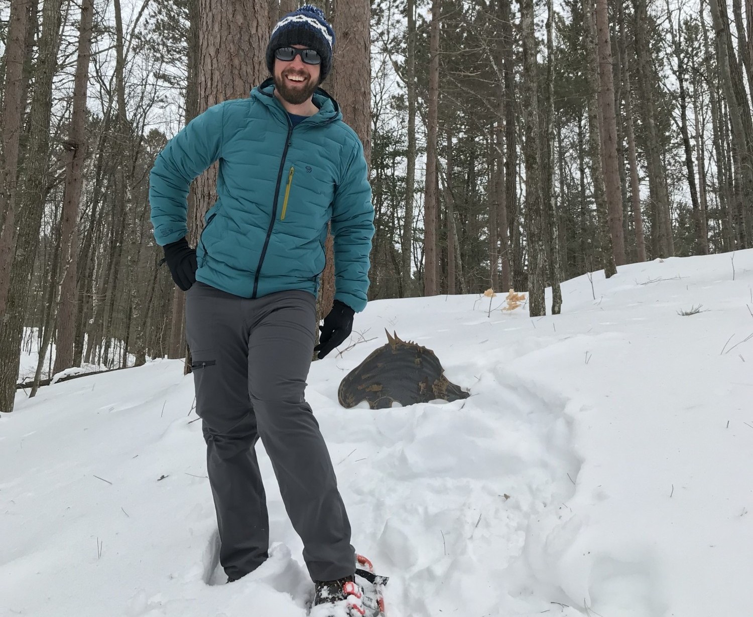 hands, feet, head warm while snowshoeing: man posing on WI trail