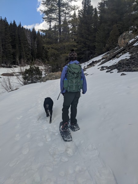 woman and dog snowshoeing with Lightning Ascents