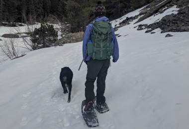 woman and dog snowshoeing with Lightning Ascents
