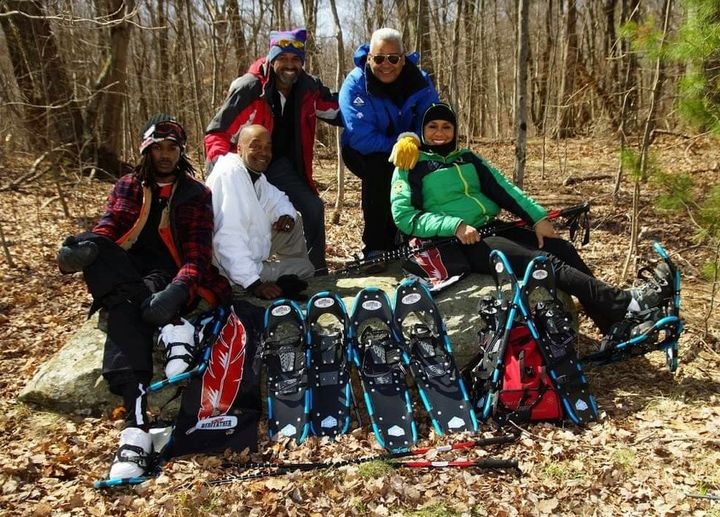 winter photo competition: group of people with snowshoes surrounded by leaves