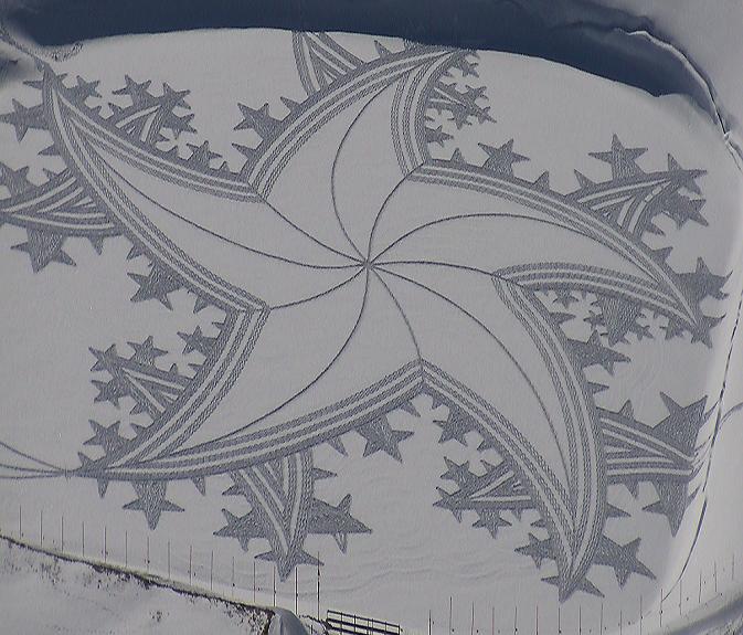 view from above of 5 point star drawn in the snow