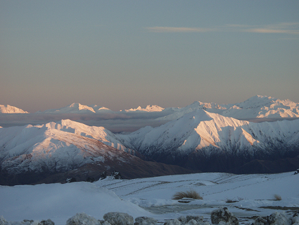 snow covered mountains and open sky in New Zealand