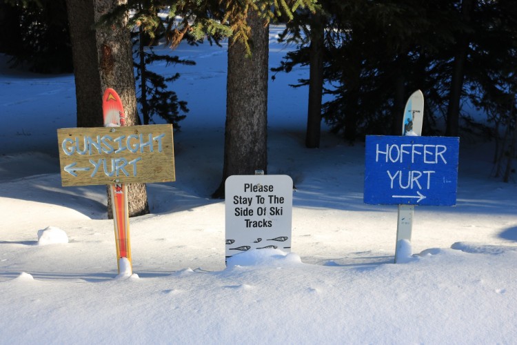 signs in the snow to huts and trails at Anthony Lakes Mountain Resort, OR