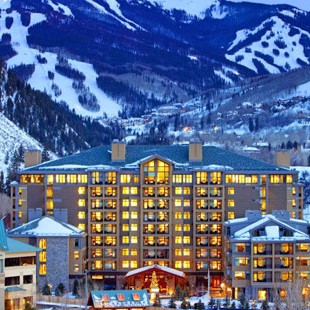 Colorado snowshoe resorts: Westin Riverfront Resort at night with mountains in background