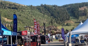 brand tents in rows with mountains in background