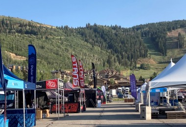 brand tents in rows with mountains in background