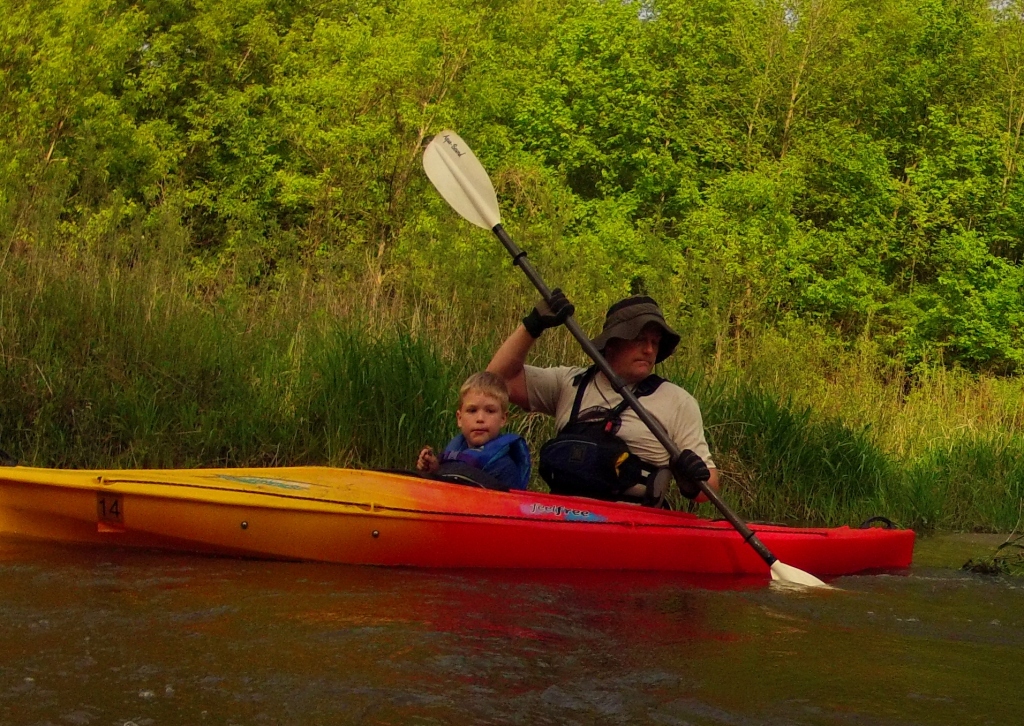 father and son in kayak