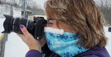 woman wearing Cozy Noze while taking a photo