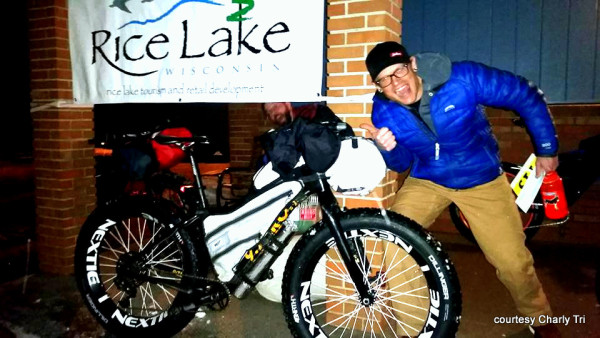 Charly Tri with the hospitable and friendly Rice Lake, WI, welcome sign for all the Tuscobia Winter Ultra competitors