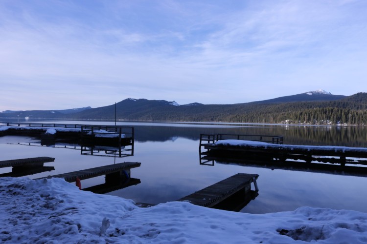 view of Odell Lake with snow and mountains in background