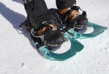 close up of snowshoes and bindings on snow