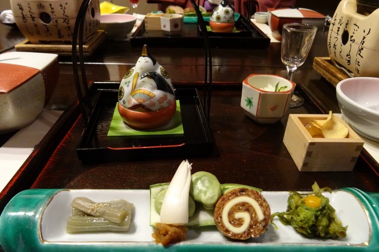 food ornamented on a tray with tea kettle