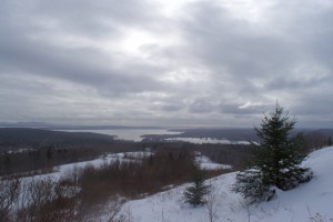 A view from the meadow of Blue Hill Bay and offshore islands, including peaks of Acadia National Park far left.