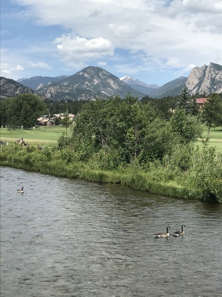view of river, golf course, mountains from Lake Estes Trail