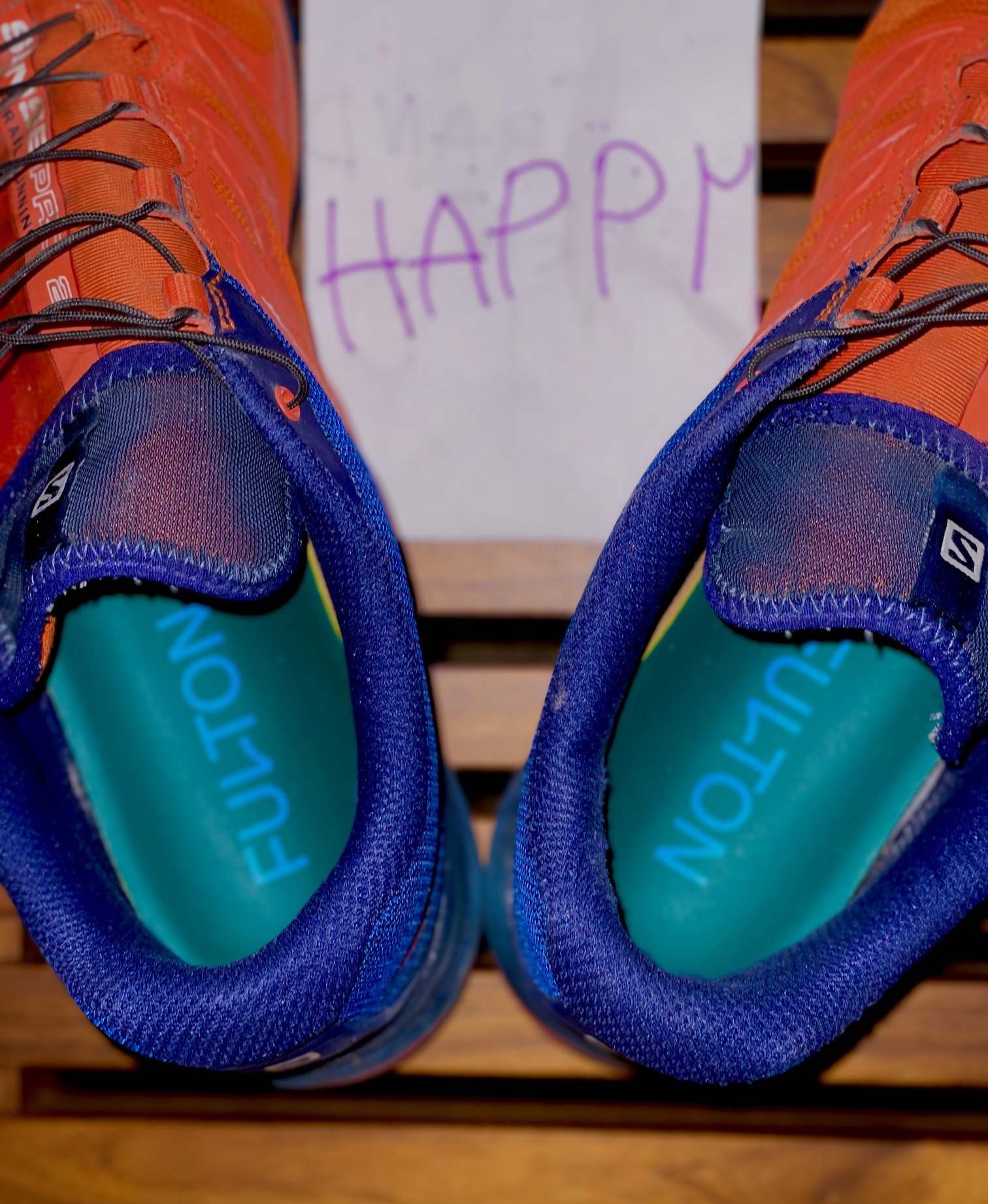 Fulton insoles in shoes with happy sign behind them