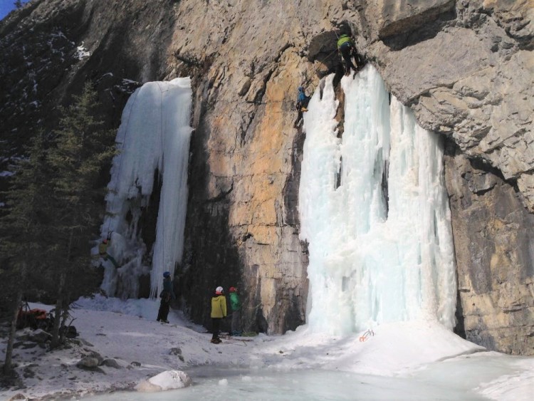 frozen waterfalls with people in background - Banff
