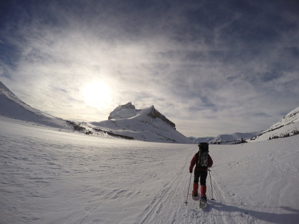 Snowshoeing across Ptarmigan Lake from Skoki Lodge