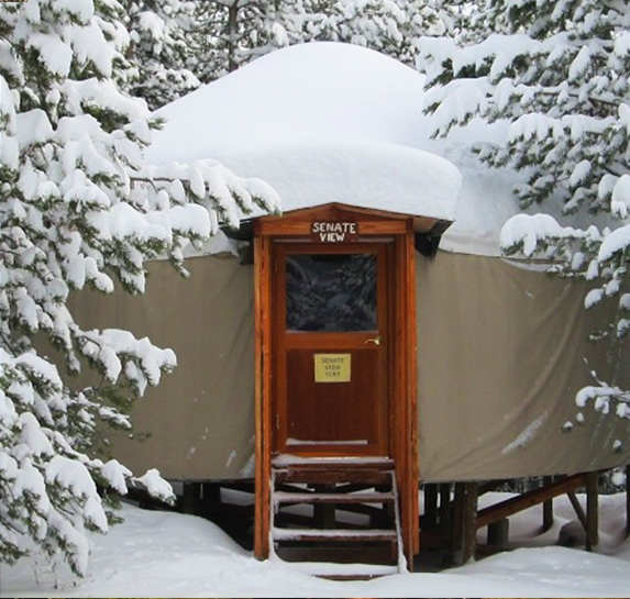 snow-covered yurt in the trees at Galena Lodge