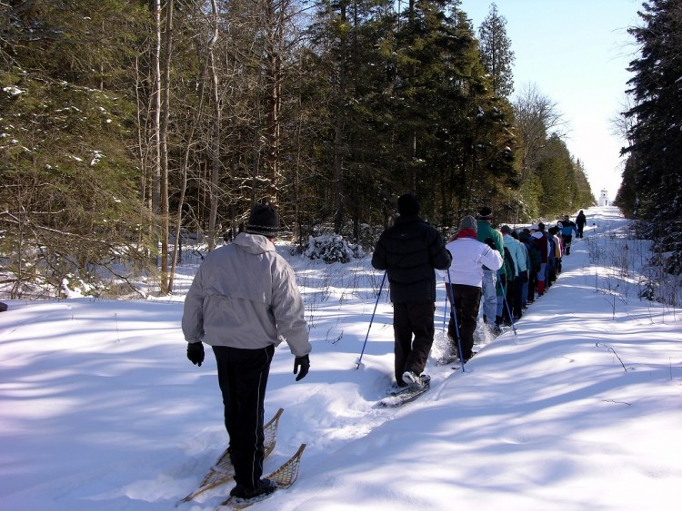 winter activities in Door County: group of snowshoers on a tour at Ridges Sanctuary