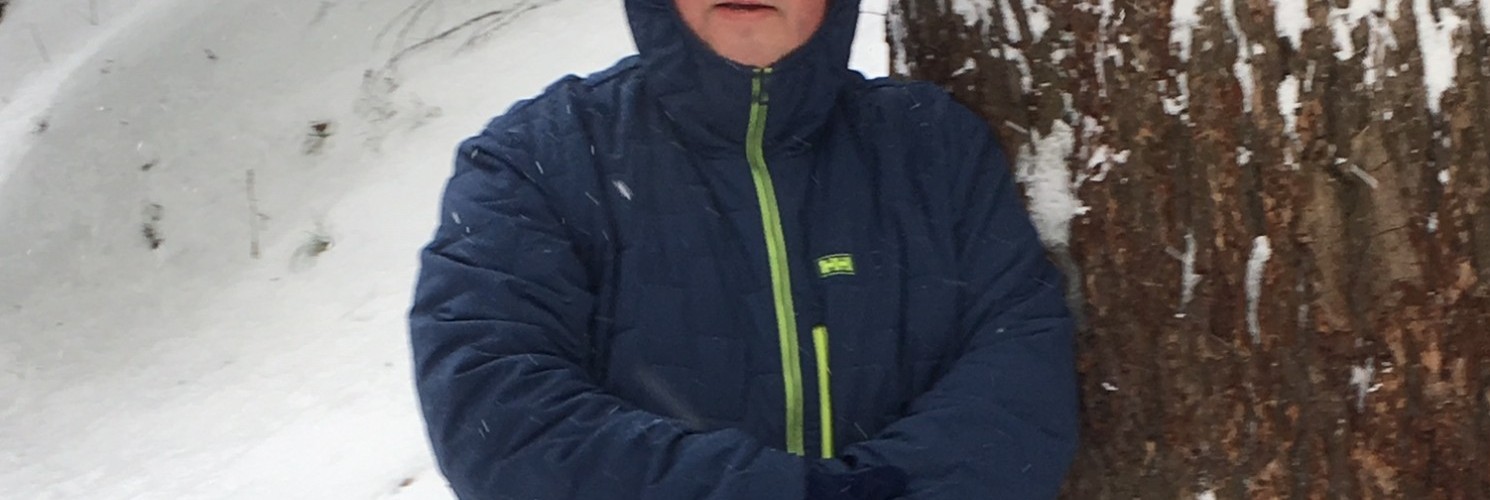 man wearing the Helly Hansen Stretch Insulator Jacket in cold weather