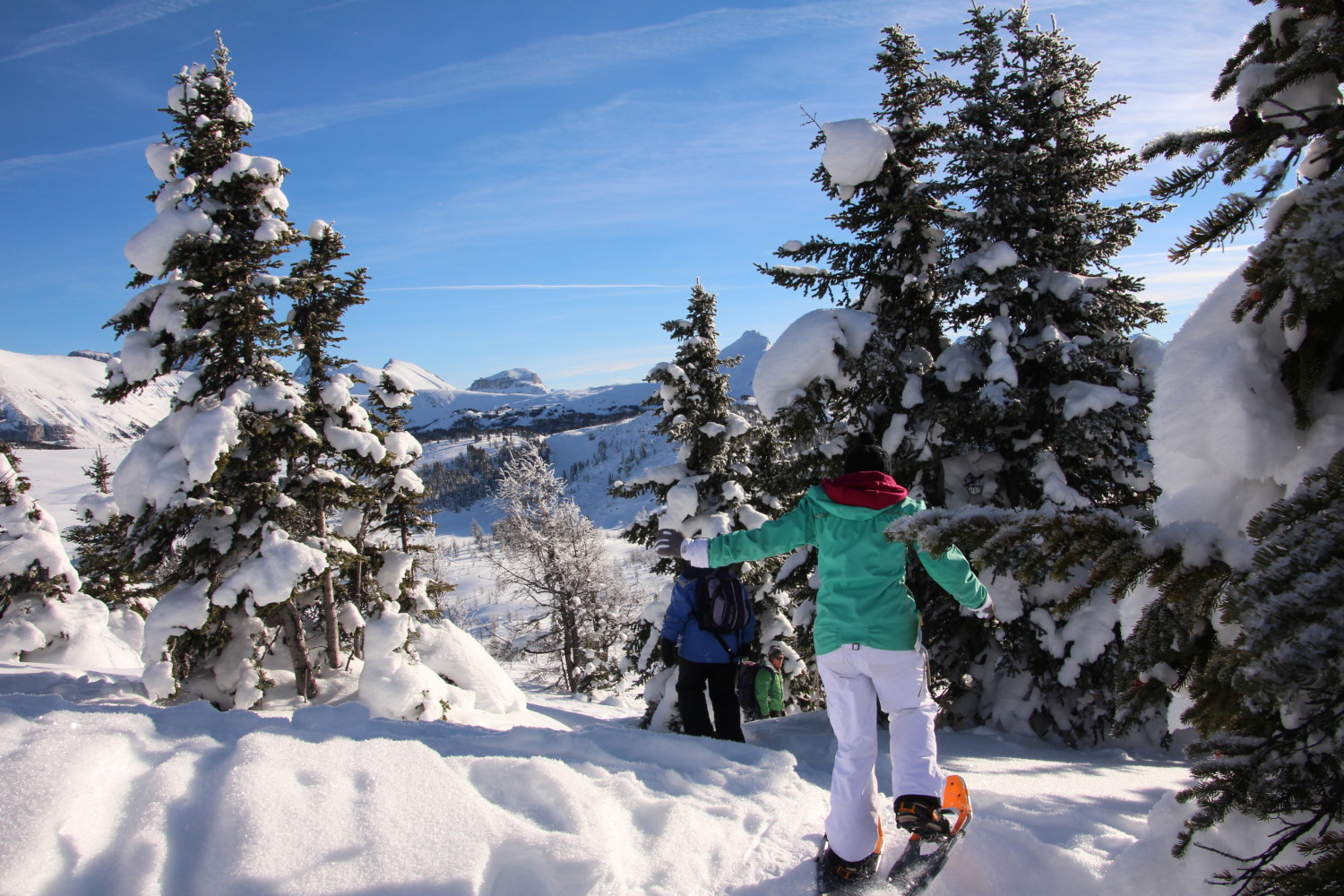 snowshoeing in Canadian Rockies with blue sky