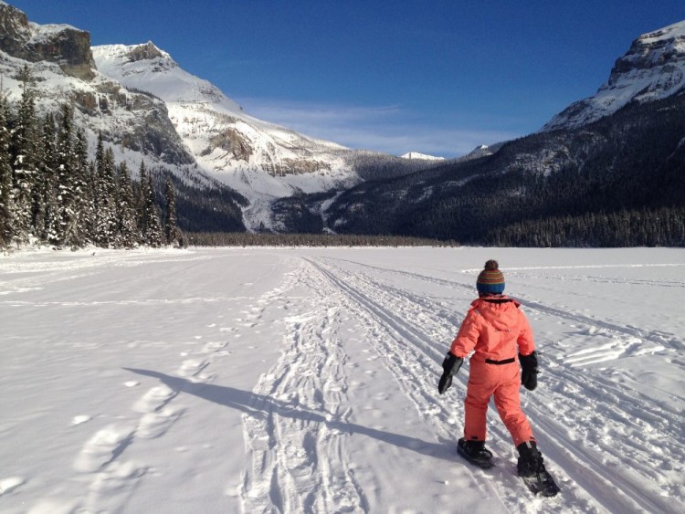 child snowshoeing across Emerald Lake BC