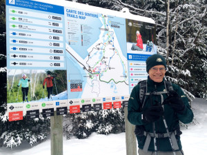 Parks Canada Guide beside trails map