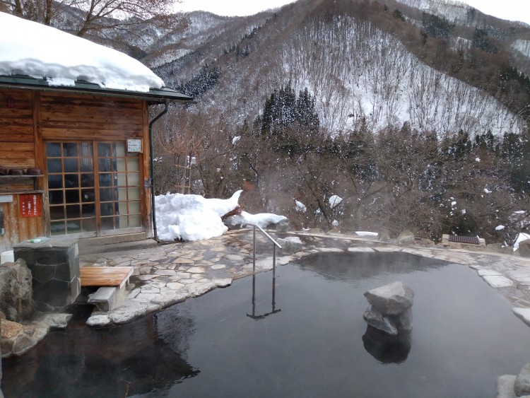 hot spring and changing room with mountain view