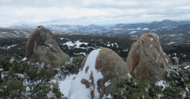 view from a mountain top with boulders in foreground