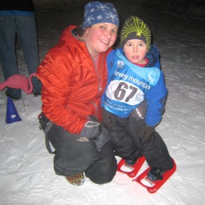 Heather and Hayden pose after his race in front of the pink flamingo. 