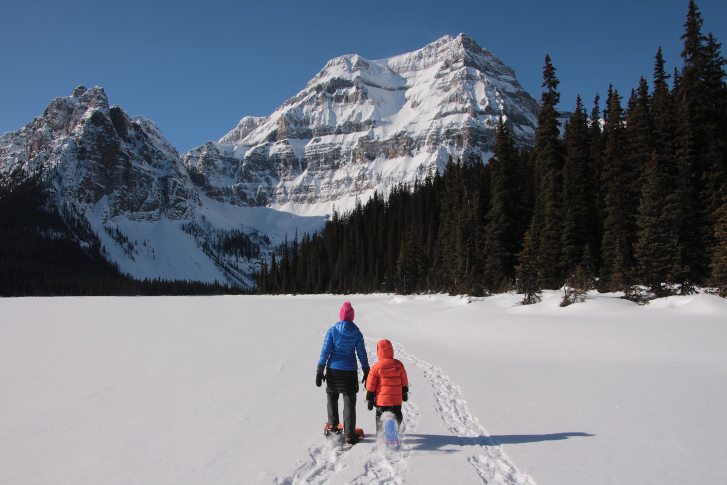 mom and son snowshoeing in Canadian Rockies, choose your trail