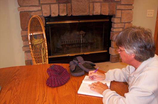 man journaling about outdoor adventures