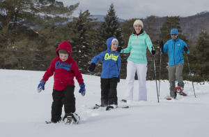 A family of snowshoers on the trail.