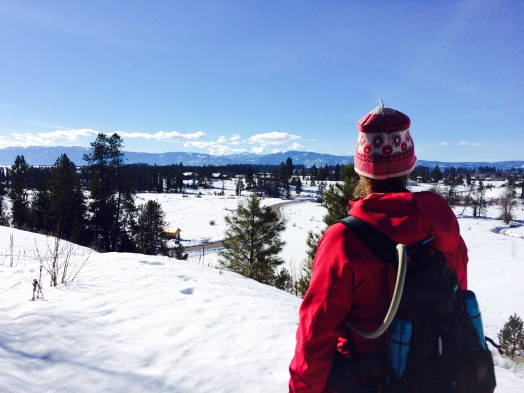 woman overlooking snow covered nordic center in McCall Idaho