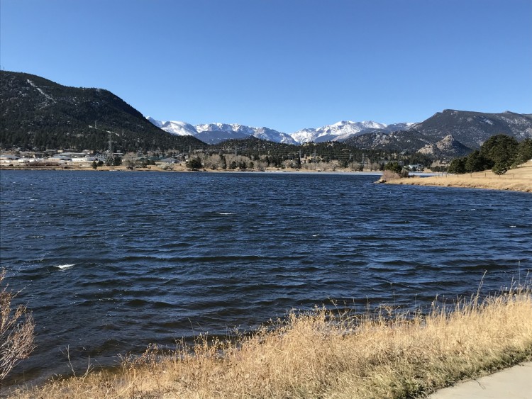 lake with snow capped mountains at Estes Lake Trail in winter