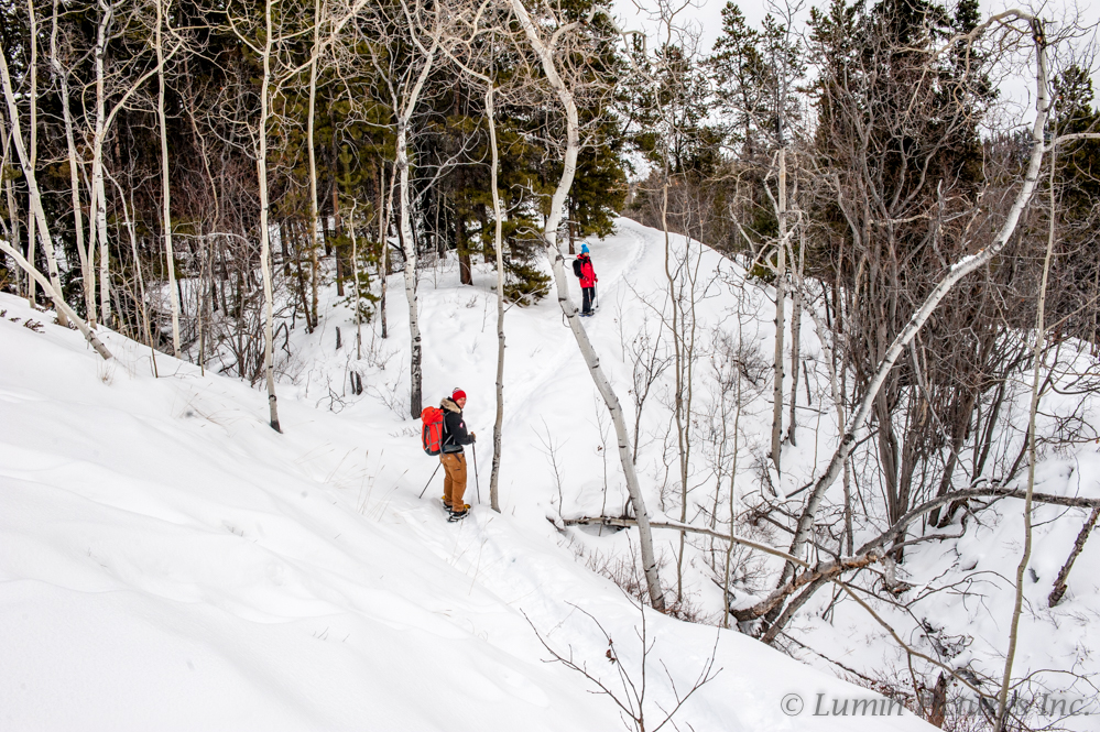 people in the distance snowshoeing Chadburn Lake in the Yukon