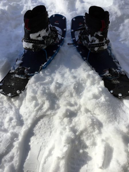 Lightning Ascent snowshoes with modular tails and boots straped in to bindings