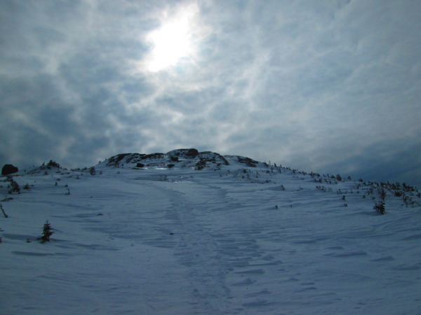 Winter snow conditions make the long hike up Mount Marcy far more demanding. Photo Credit: Tim Moody