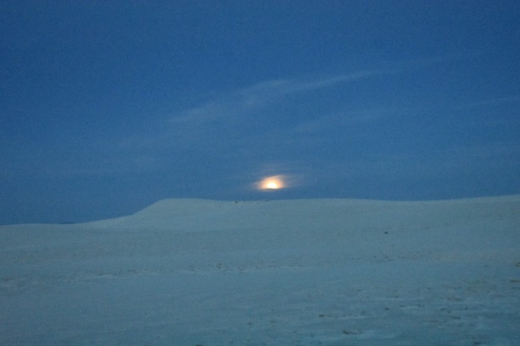 moon rising over sand at White Sands National Park