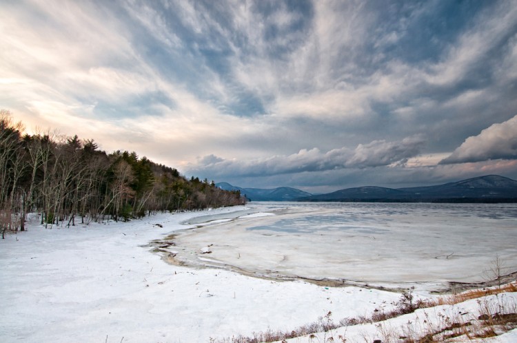 lake with snow and mountains and open sky in background